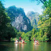 Day trippers from Khao Lak enjoy a rafting expedition in Khao Sok National Park