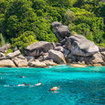 Tourists snorkel in the Similan Islands National Park
